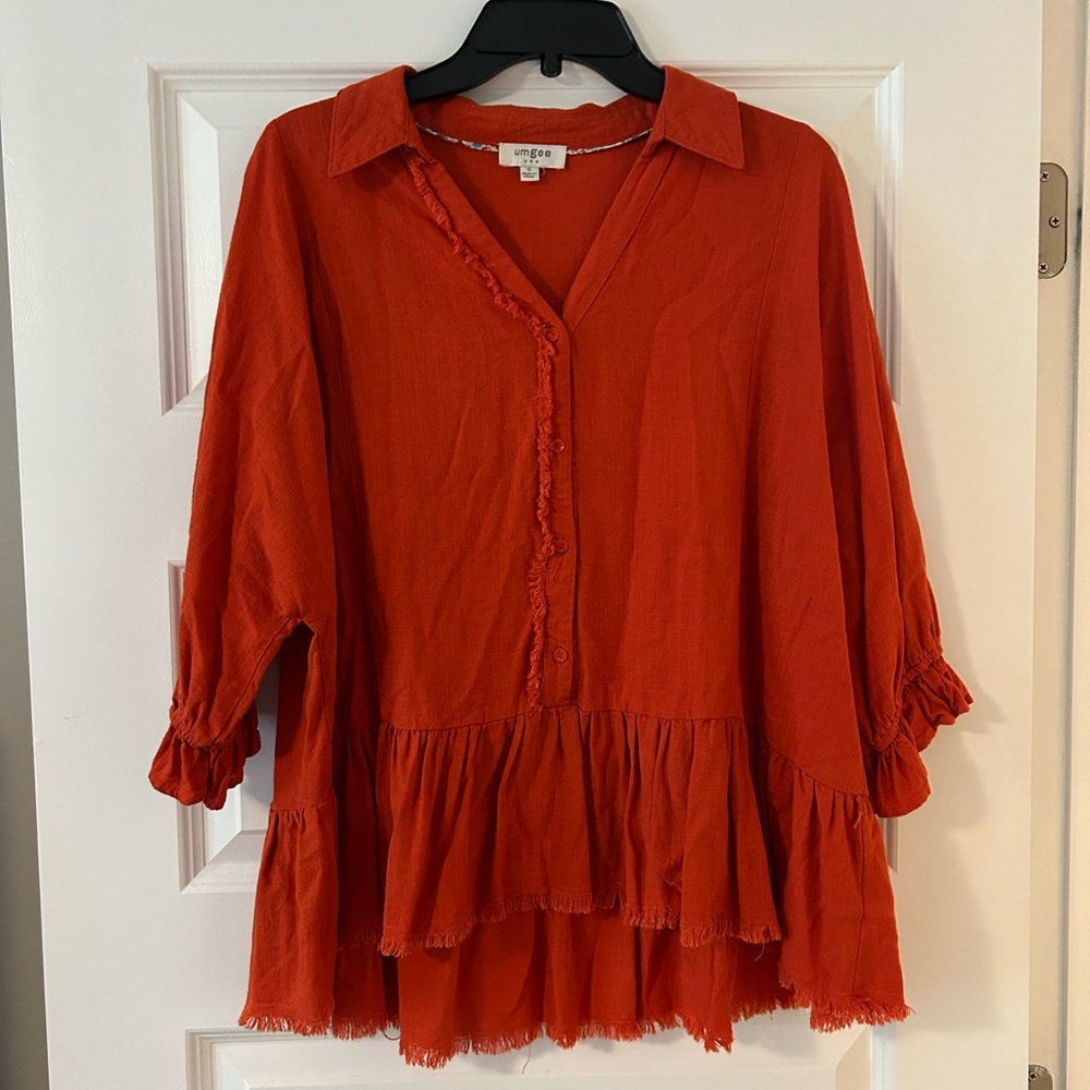 Umgee Orange Blouse with Notched Collar and Ruffled Hem